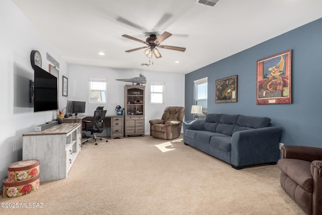 office area with light carpet and ceiling fan