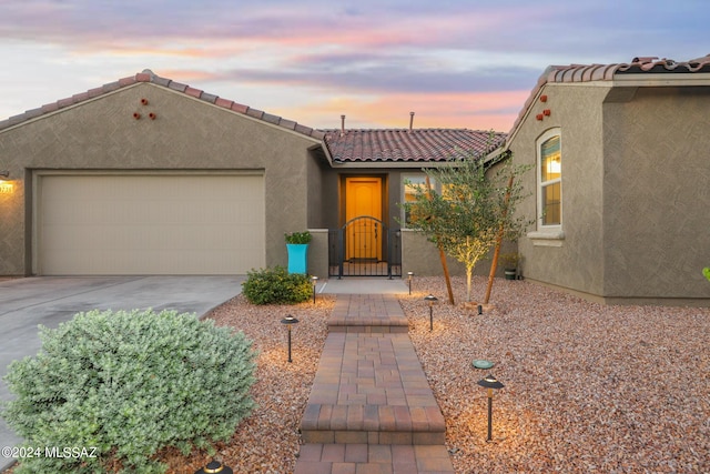 view of front of property with a garage