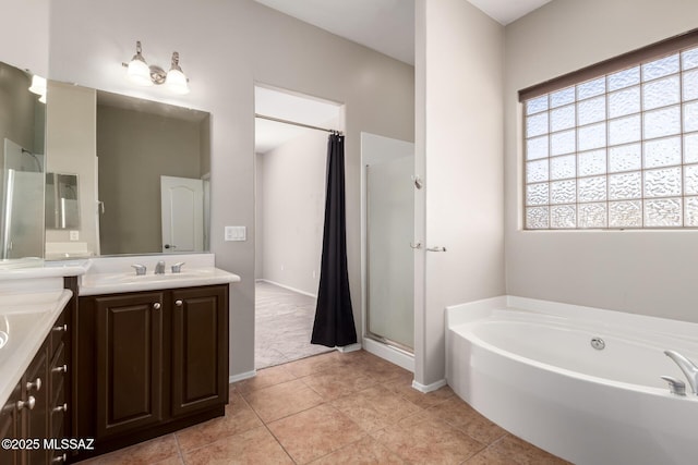 bathroom with tile patterned floors, vanity, and plus walk in shower