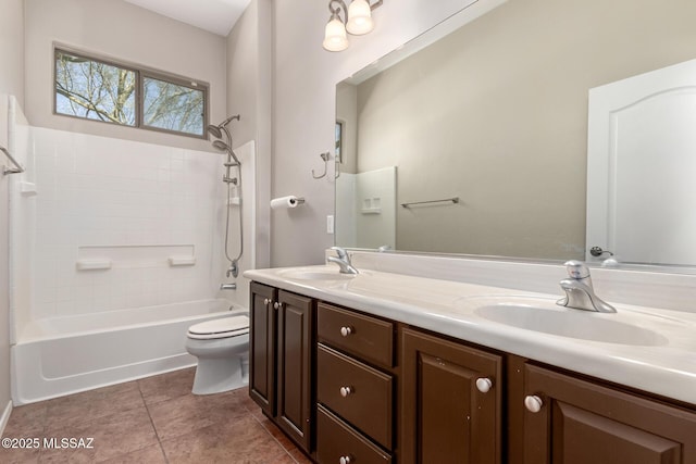 full bathroom featuring toilet, vanity, bathtub / shower combination, and tile patterned flooring