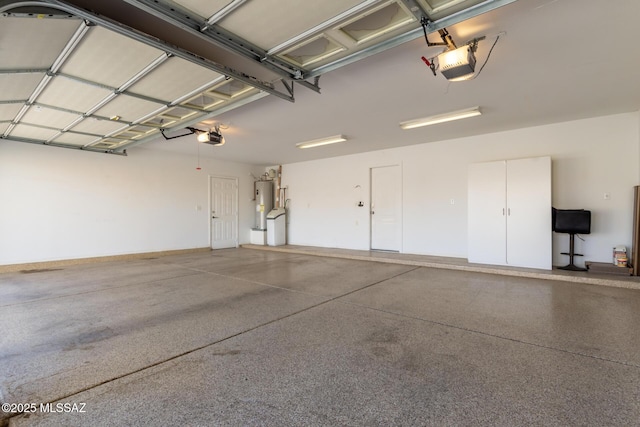 garage featuring a garage door opener and water heater