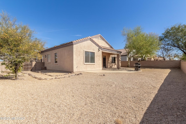 rear view of property with a patio