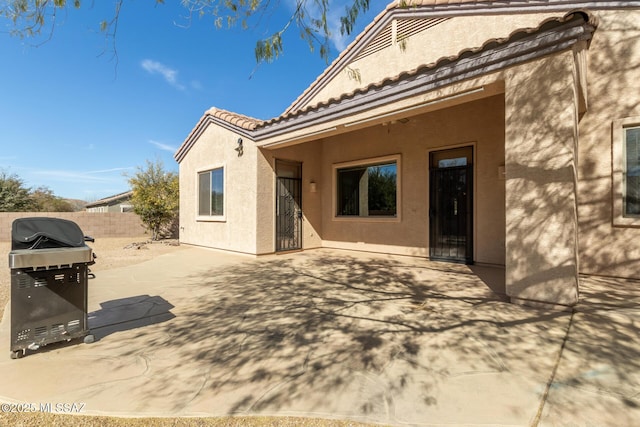 rear view of house featuring a patio area