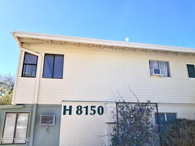 view of side of home with cooling unit