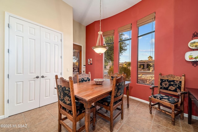 dining room featuring light tile patterned floors and baseboards