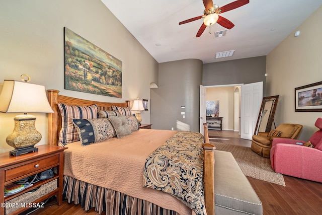 bedroom featuring visible vents, ceiling fan, and wood finished floors