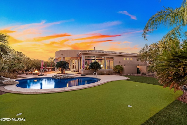 view of pool featuring a patio and a pool with connected hot tub