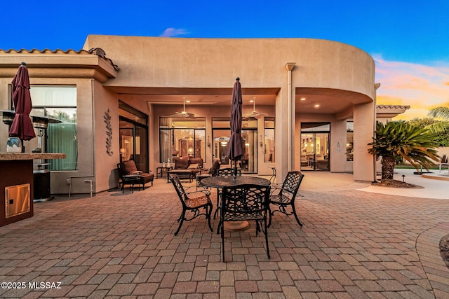 view of patio terrace at dusk