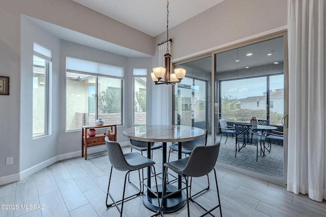 dining area with a notable chandelier