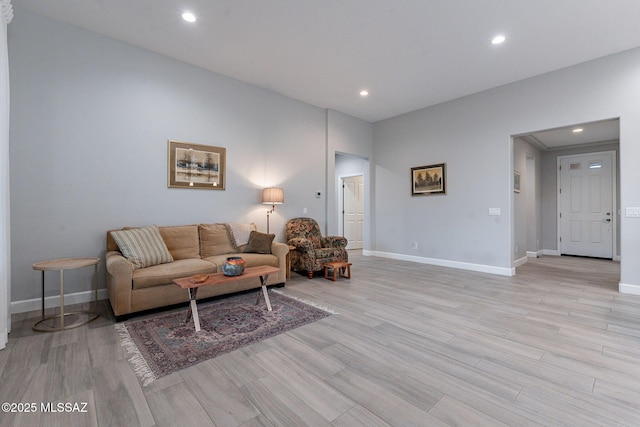 living room with light hardwood / wood-style flooring