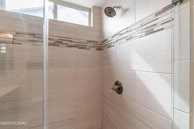 bathroom with tiled shower