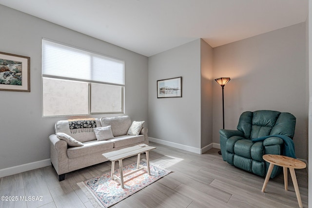 living room with light hardwood / wood-style flooring