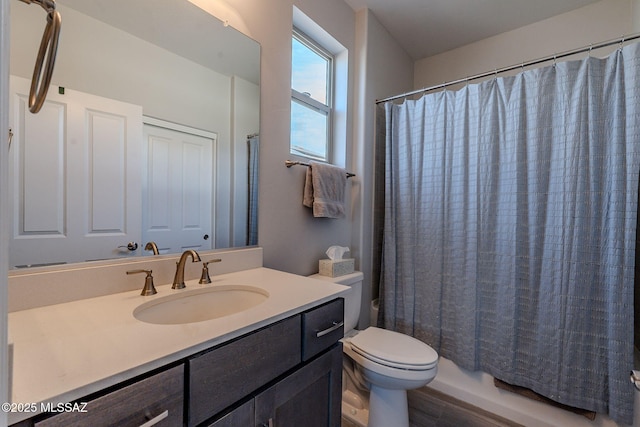 full bathroom with vanity, toilet, and shower / bath combo