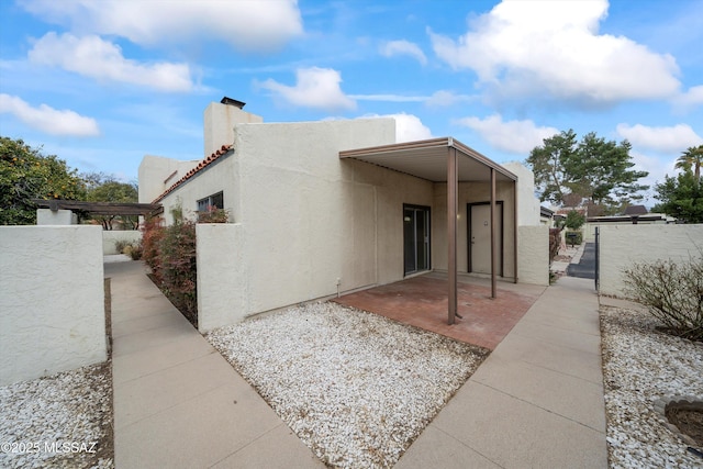 view of front of home featuring a patio area