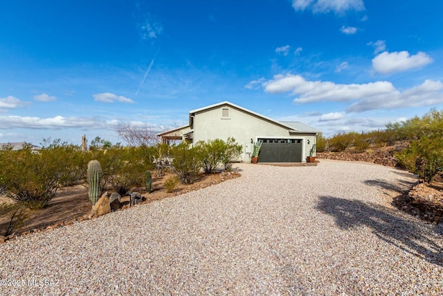 view of property exterior with a garage