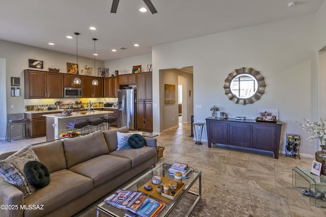 living room with ceiling fan