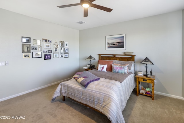 bedroom featuring ceiling fan and light carpet