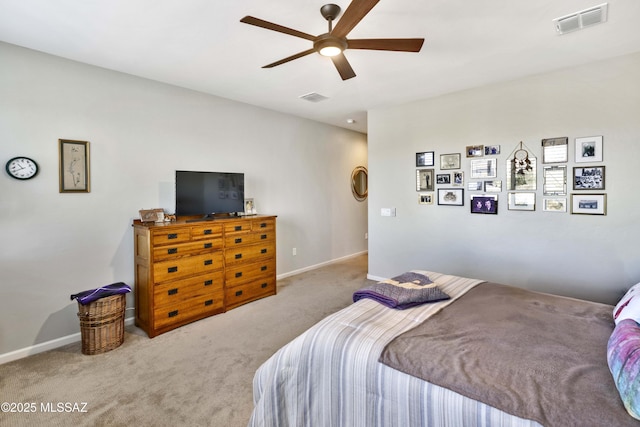 bedroom with light colored carpet and ceiling fan