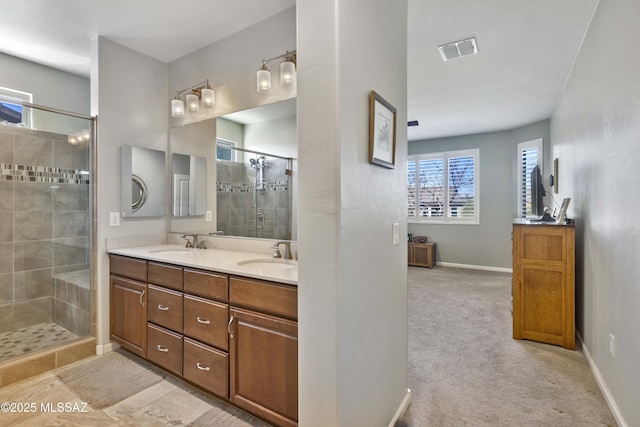 bathroom with vanity and a shower with shower door