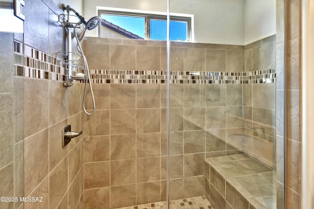 bathroom featuring a tile shower