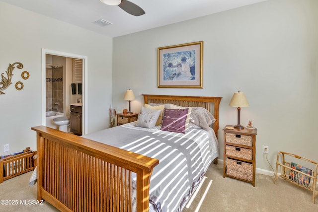 carpeted bedroom with connected bathroom and ceiling fan