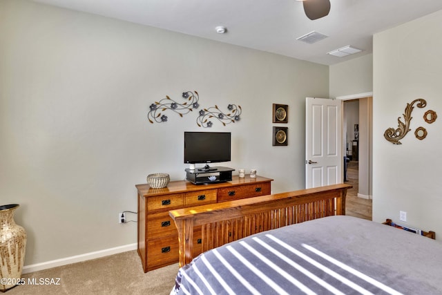 bedroom with light colored carpet