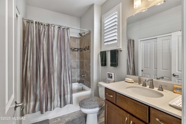 full bathroom with vanity, shower / bath combination with curtain, and toilet