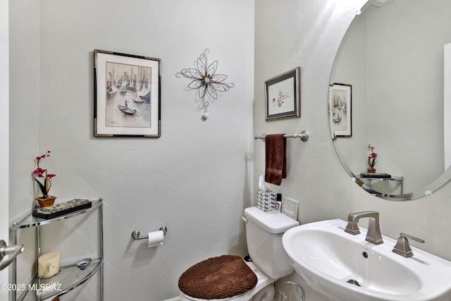 bathroom with sink and toilet