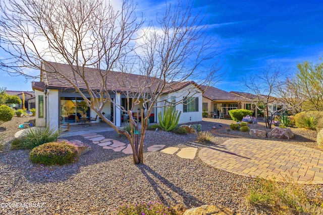 rear view of house with a patio area