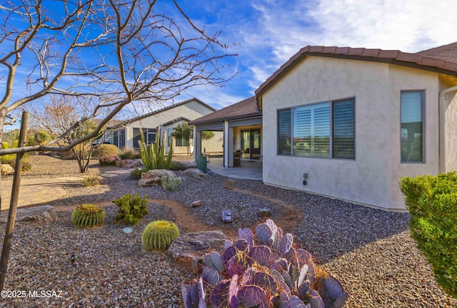 view of home's exterior with a patio area