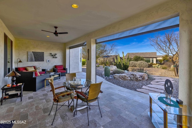 view of patio featuring ceiling fan and outdoor lounge area