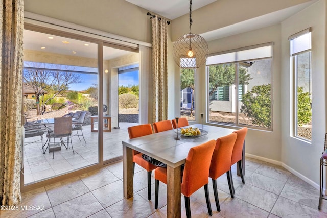 dining room with plenty of natural light and french doors