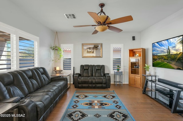 living room with hardwood / wood-style floors and ceiling fan