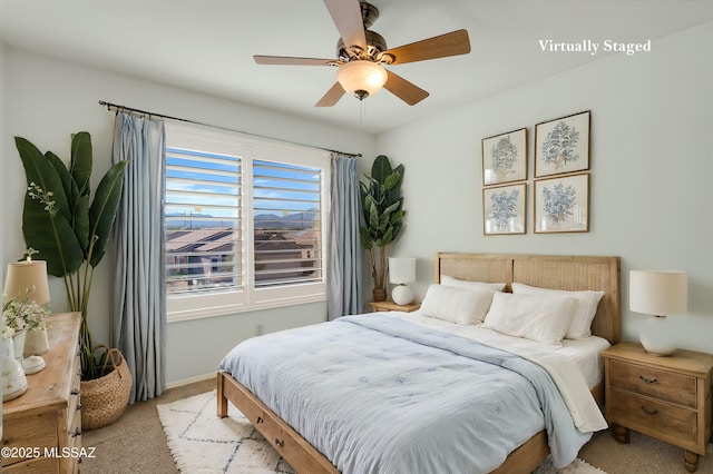 carpeted bedroom featuring ceiling fan