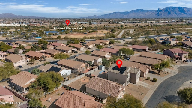 birds eye view of property with a mountain view