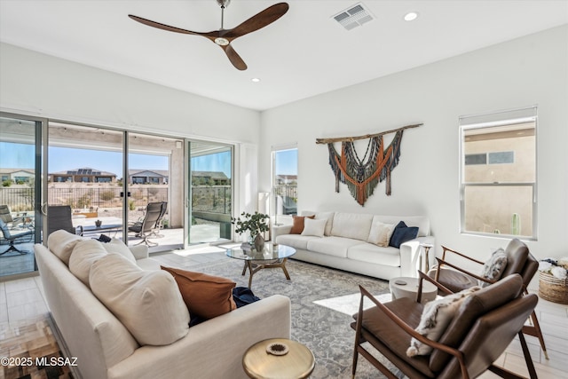 living room featuring ceiling fan and light wood-type flooring