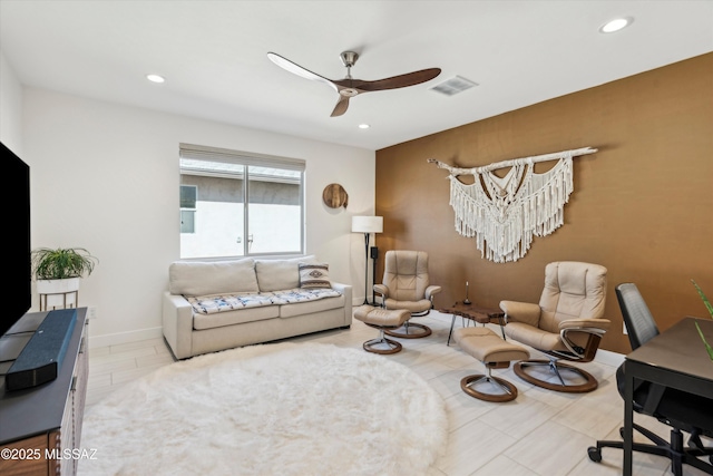 living room featuring ceiling fan