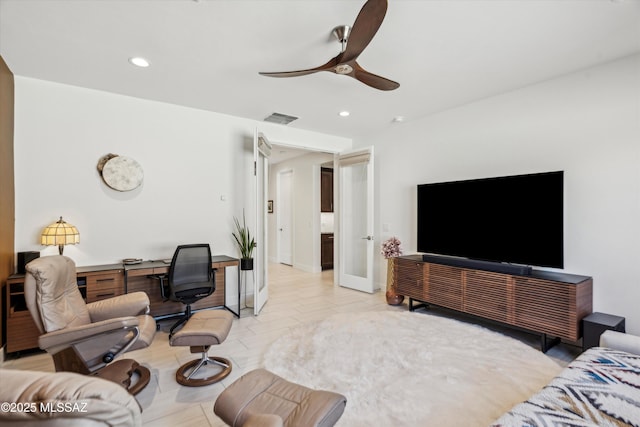 living room featuring ceiling fan