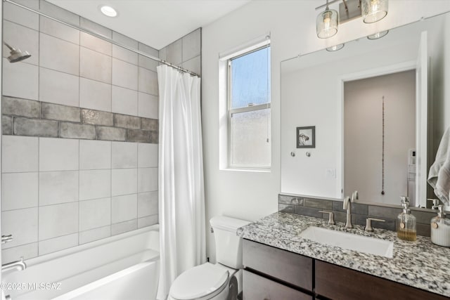 full bathroom with vanity, toilet, and shower / bath combo with shower curtain