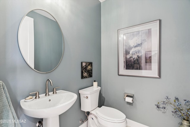 bathroom with sink and toilet