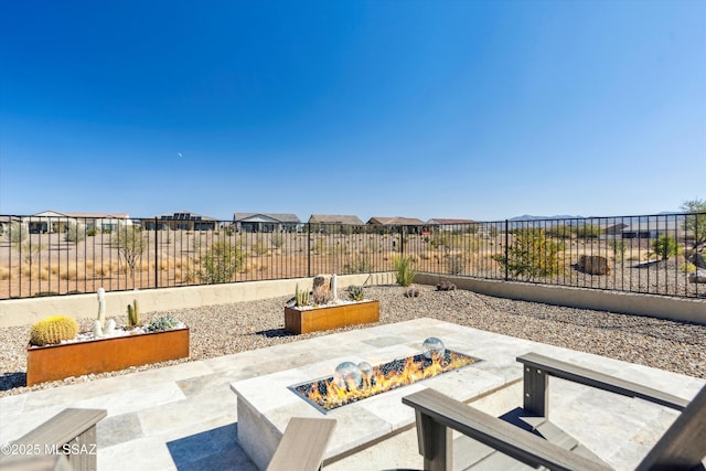 view of patio / terrace with an outdoor fire pit