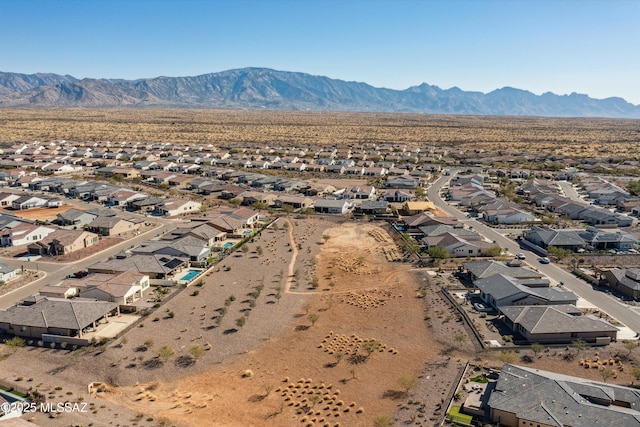 birds eye view of property featuring a mountain view