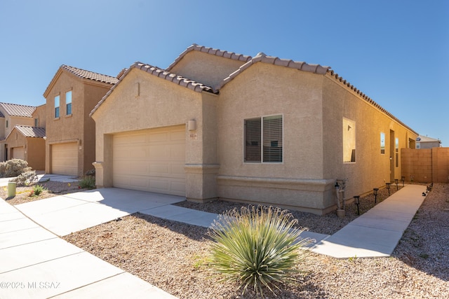 mediterranean / spanish-style home featuring a garage