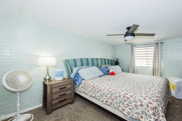 carpeted bedroom with brick wall and a ceiling fan