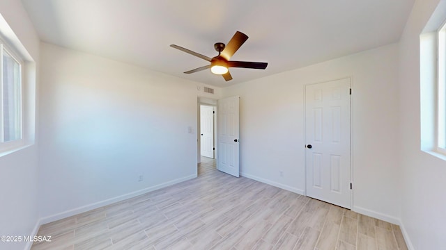 unfurnished bedroom featuring ceiling fan and light wood-type flooring