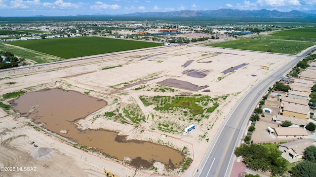 aerial view featuring a water and mountain view