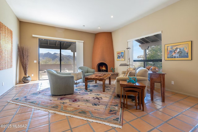 sitting room with recessed lighting, a fireplace, and tile patterned floors