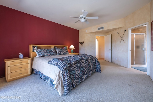 bedroom featuring arched walkways, carpet flooring, ceiling fan, and visible vents