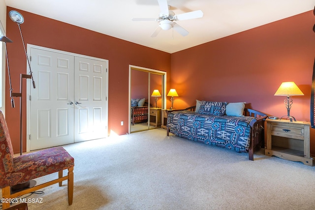 carpeted bedroom with a ceiling fan