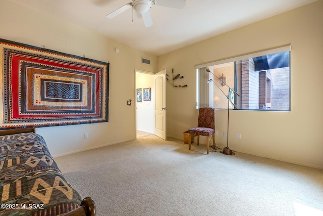 unfurnished bedroom featuring carpet floors, visible vents, and ceiling fan